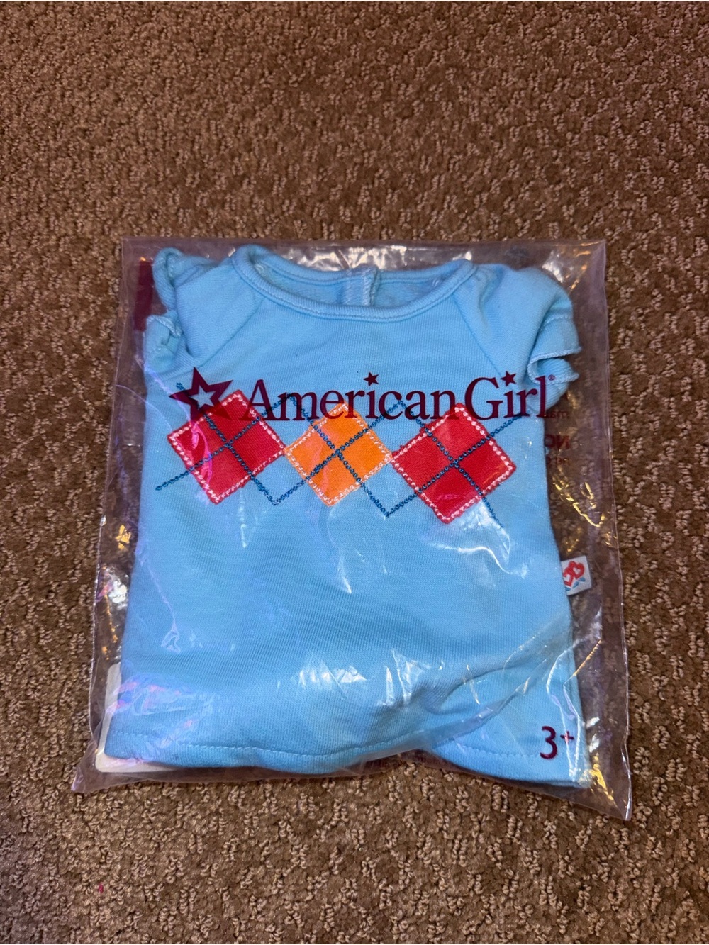American Girl Light Blue Short Sleeve Tee with Red and Orange Argyle